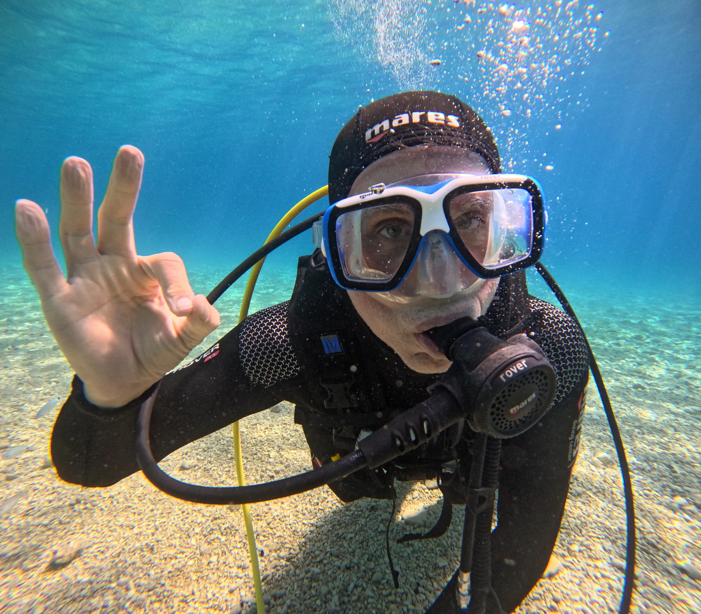 Student diver giving the OK sign underwater during a course